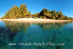 Picture showing the absolute beachfront villa accommodation right beside this gorgeous Aitutaki beach and views of Aitutaki lagoon.