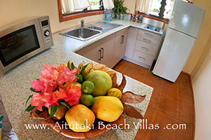 fruit bowl with pawpaw, grapefruit and lemon in the kitchen