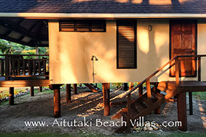 showing the outside shower with steps leading up to bathroom